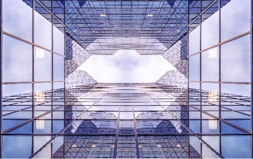 Bottom perspective of a modern glass building.