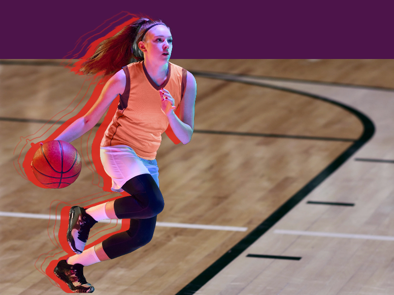 Female basketball player dribbling the ball